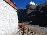 13 Tibetan Mother And Two Children Circumambulate Chuku Nyenri Gompa On Mount Kailash Outer Kora A Tibetan mother carries one child on her back while her son accompanies her on a circumambulation of Chuku (Nyenri) Gompa with Mount Kailash in the background.